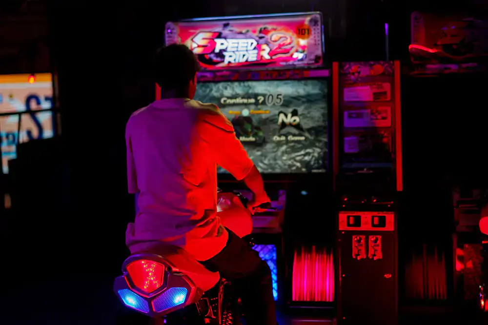 Players enjoying arcade games with glowing neon lights