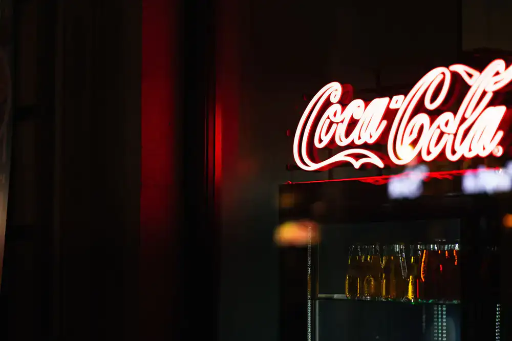 Neon lit drinks at the arcade bar